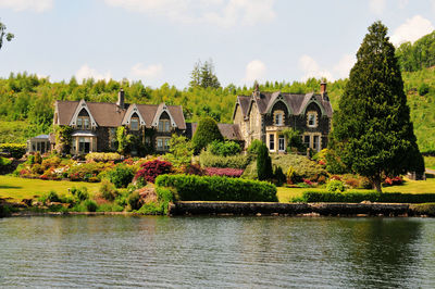 Photographed in windermere lake, england, several british houses on the bank of the lake