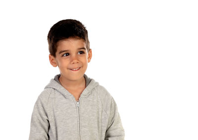 Portrait of smiling boy against white background