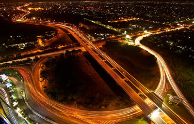 High angle view of light trails on road at night