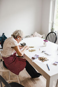 Woman counting coins