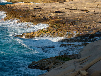 Sea waves splashing on rocks