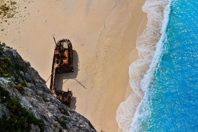 High angle view of shipwreck at shore of beach