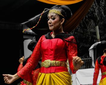 Woman looking away in traditional clothing