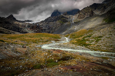 Mountains and stream near the fellaria glacier. italian alps