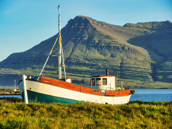 Sailboat moored in bay