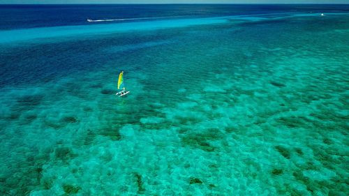 High angle view of boat sailing in sea