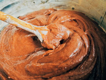 Close-up of chocolate cake batter in container