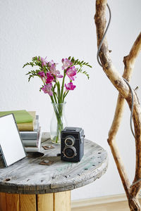 Flower vase on table at home