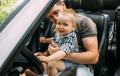 Children sitting in car