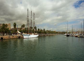 Sailboats in sea against sky