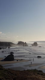 Scenic view of beach against clear sky