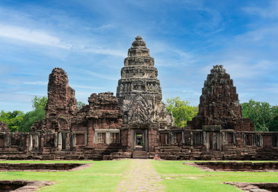 Old temple building against sky