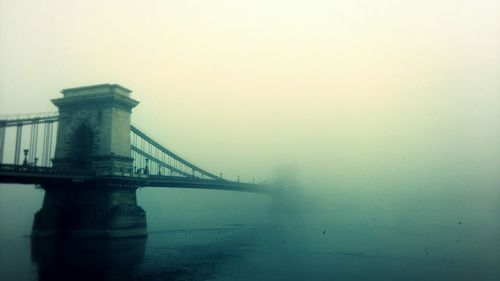 View of bridge against sky in city
