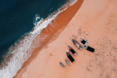 Aerial view of boats moored on beach