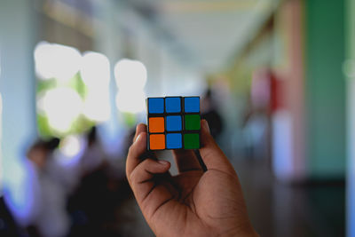 Close-up of hand holding toy car