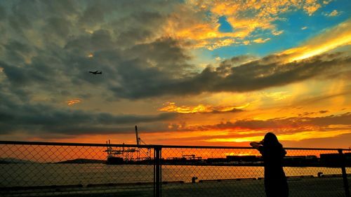 Scenic view of cloudy sky at sunset