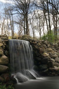 Scenic view of river flowing through rocks