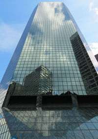 Low angle view of skyscraper against sky