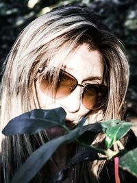 Close-up portrait of woman wearing sunglasses