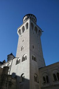 Low angle view of tower against clear blue sky