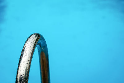 High angle view of wet railing