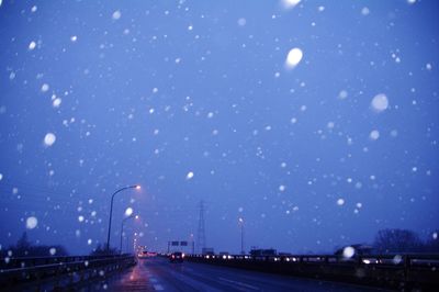 Illuminated road at night
