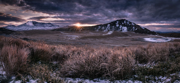 Scenic view of mountains against sky during sunset