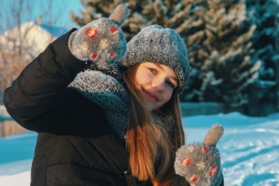 Portrait of woman in hat during winter