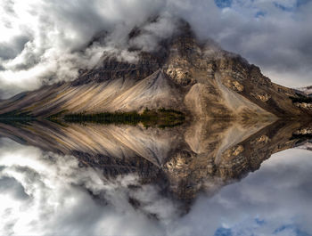 Reflection of mountain in lake against sky