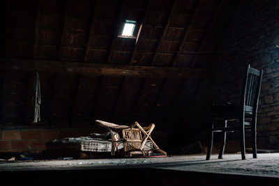 View of an empty chairs against wall