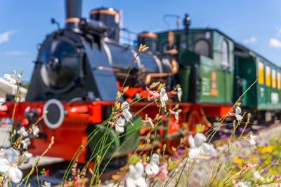 Train on railroad track against sky