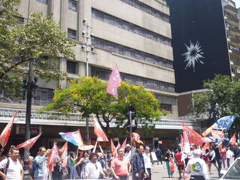 People at outdoor cafe in city