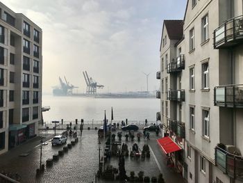 Panoramic view of sea and buildings against sky