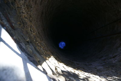 High angle view of stone wall in tunnel