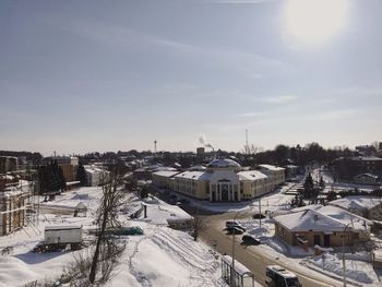 High angle view of snow covered buildings against sky