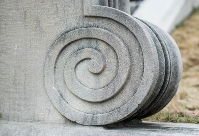 Close-up of spiral pattern on stone wall