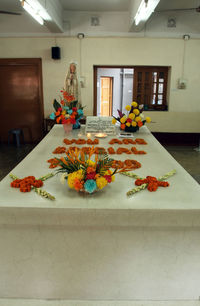 Various flowers on table