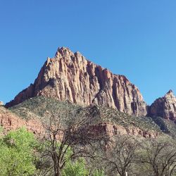 Scenic view of rocky mountains against clear sky