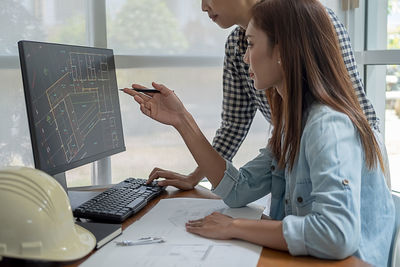 Woman using laptop on table