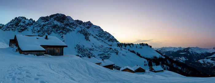 Scenic view of snow covered mountain against sky