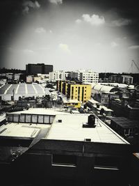 High angle view of buildings in city against sky