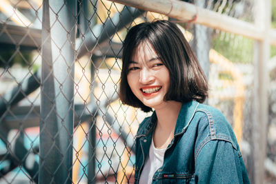 Portrait of smiling young woman outdoors