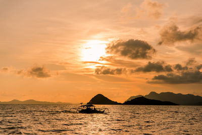 Cruising the seas of coron, palawan at sunset.