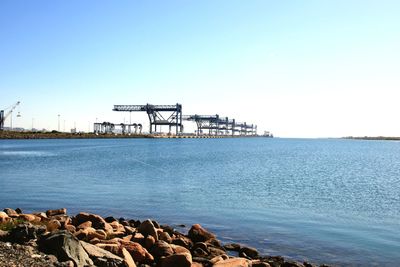 Scenic view of sea against clear blue sky