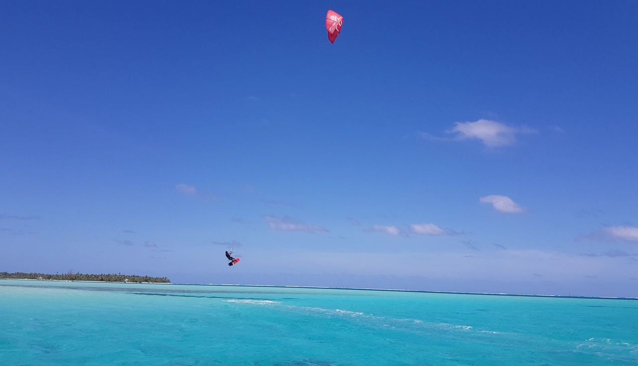 SCENIC VIEW OF BEACH AGAINST BLUE SKY