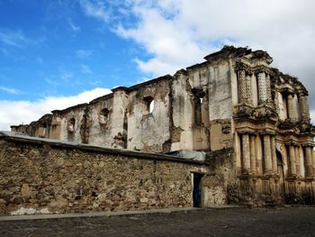 Low angle view of old building against sky