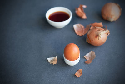 Instructions how to color easter eggs with natural dye. orange color from onion skin. copy space.