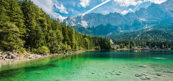 Scenic view of lake against cloudy sky