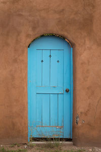 Closed blue door of building