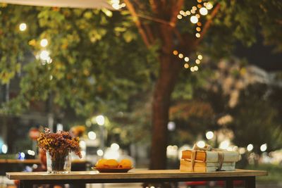 Close-up of illuminated candles on table